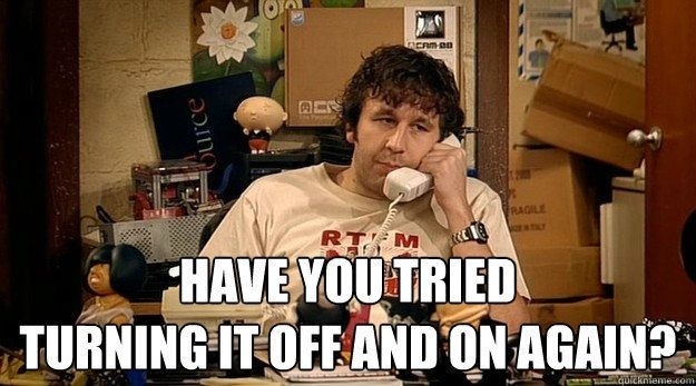 A screenshot of the show "The IT Crowd" where Roy is on the phone and asks "Have you tried turning it of an on again?"